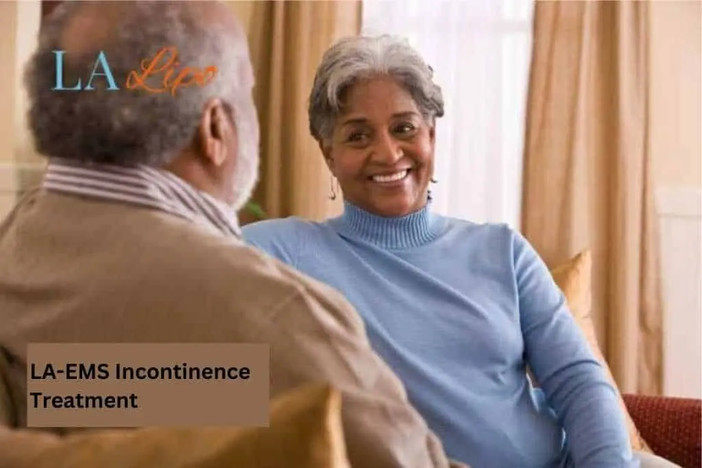 Couple sat smiling at each other - LA-EMS treatment Swansea