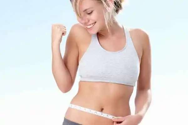 woman happy after fat reduction treatment Swansea