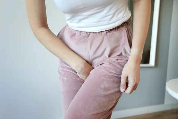 woman struggling with urine incontinence Swansea