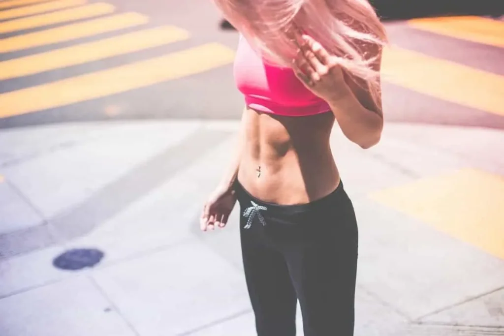 Woman with toned stomach after LA-EMS Body Sculpting Treatment Swansea 